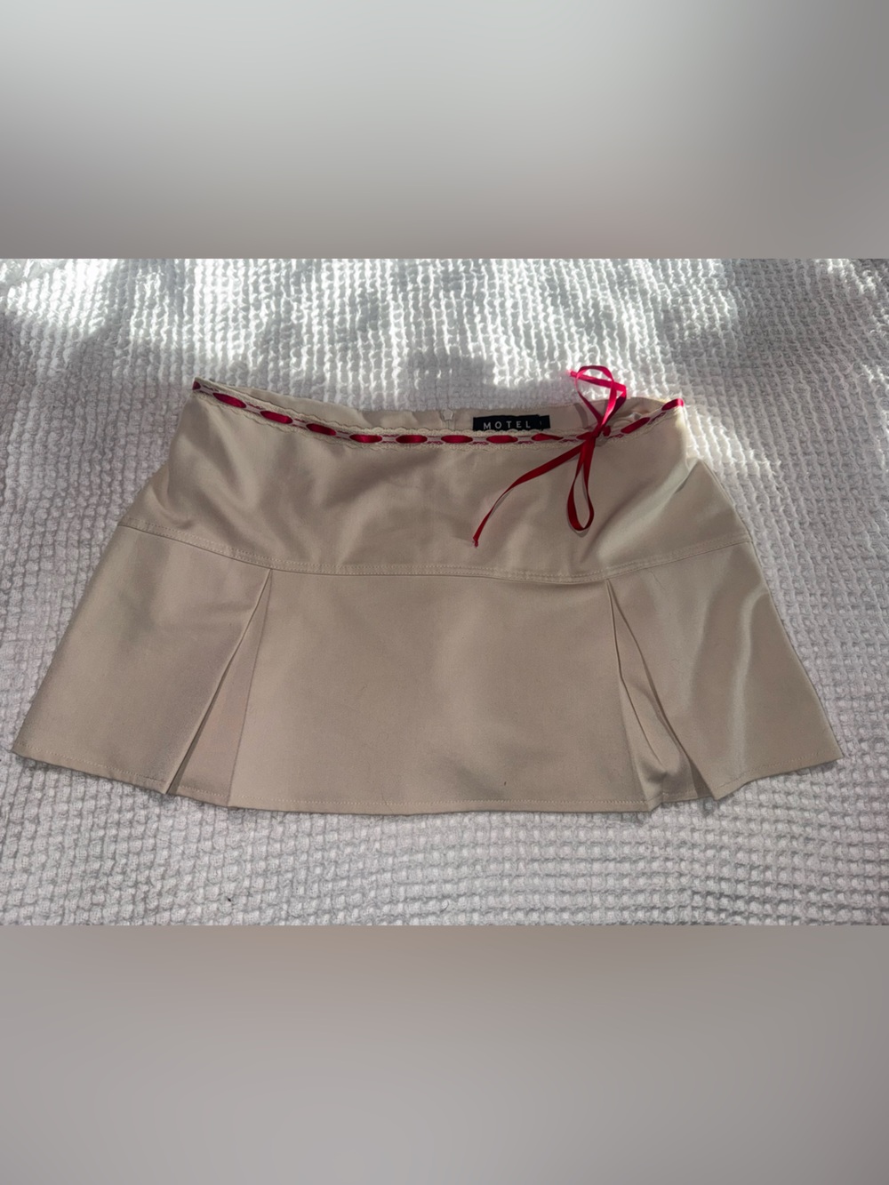 Motel Rocks Cream Pleated Mini Skirt with Red Lace-Up Waist